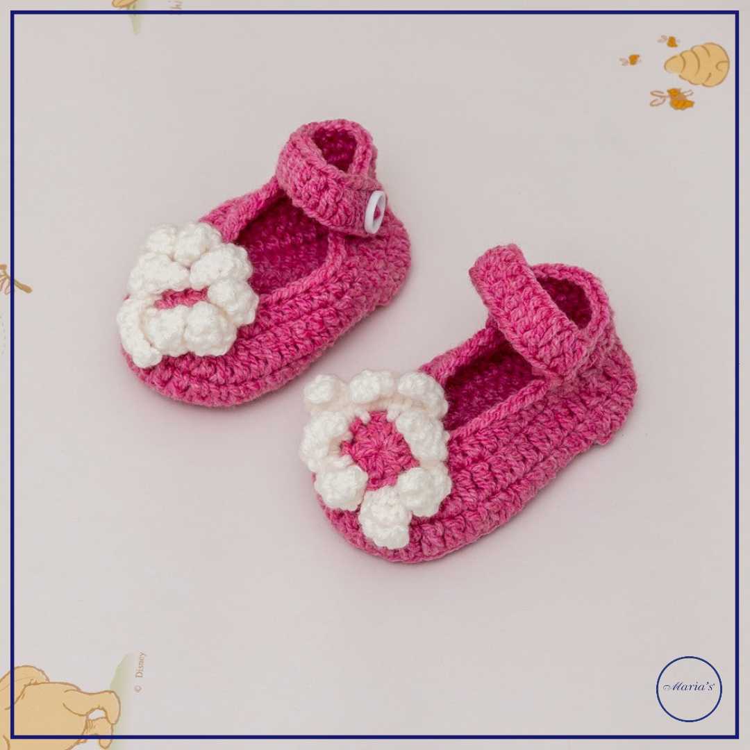 Knitted Booties With Embroidered Motive