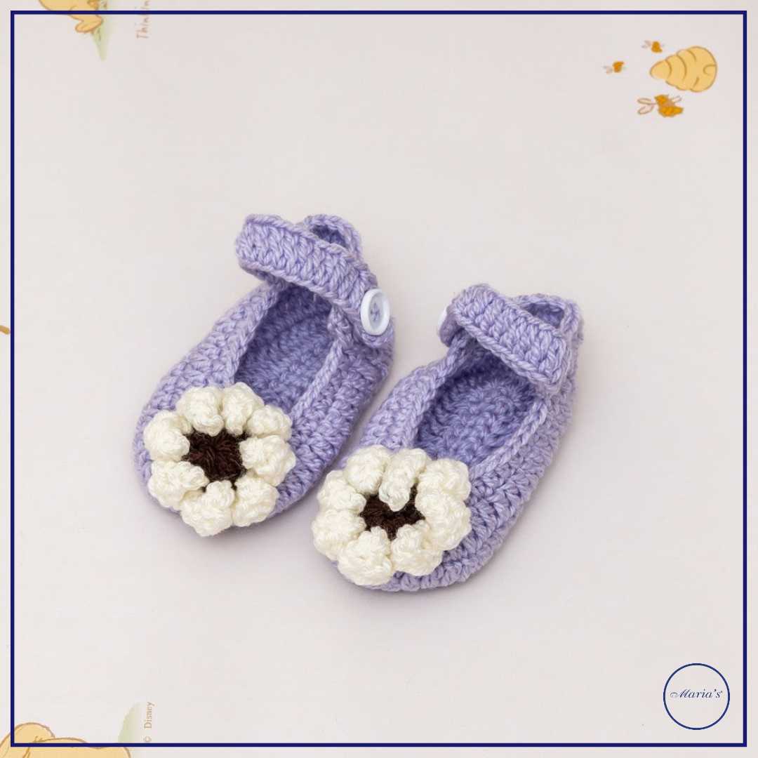 Knitted Booties With Embroidered Motive