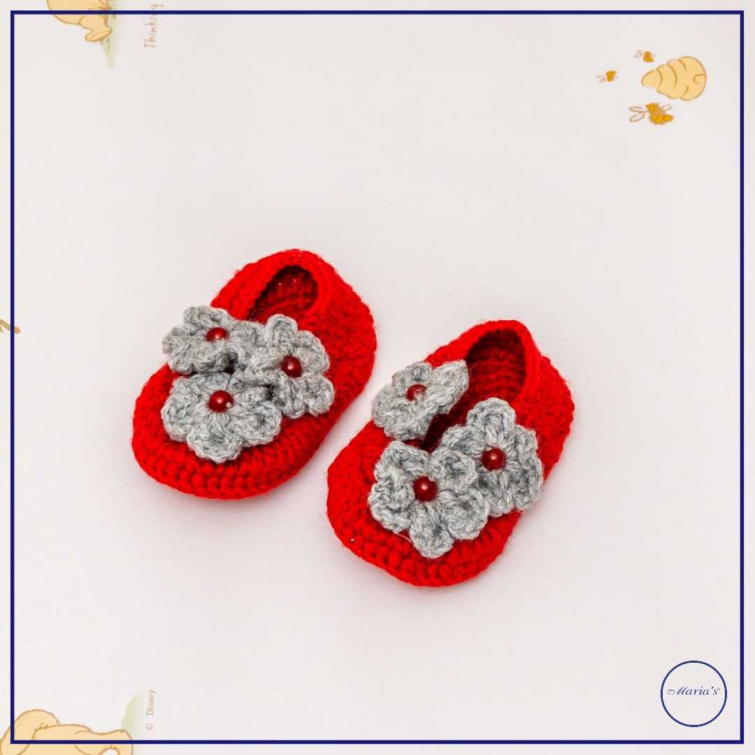 Knitted Booties With Embroidered Motive