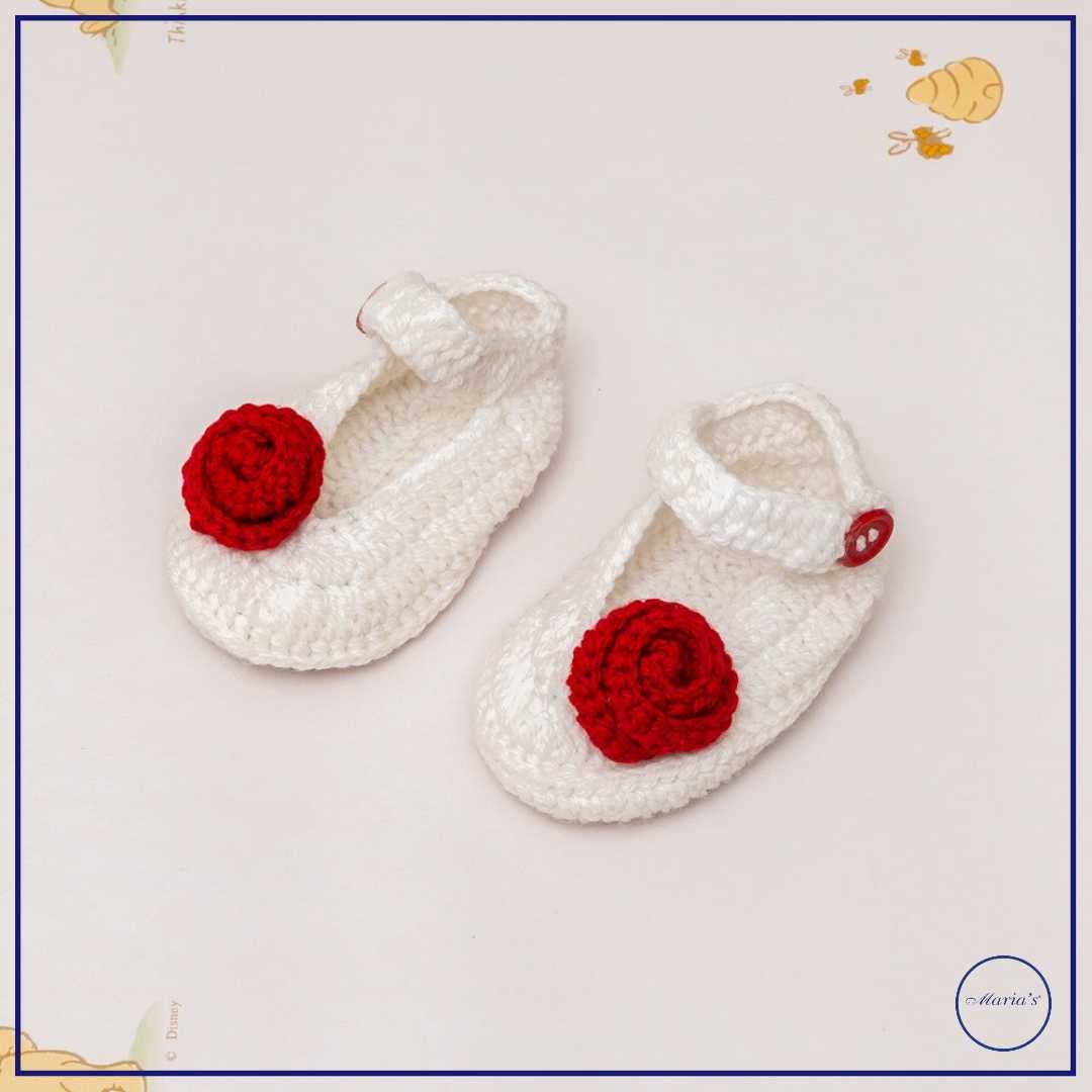 Knitted Booties With Embroidered Motive