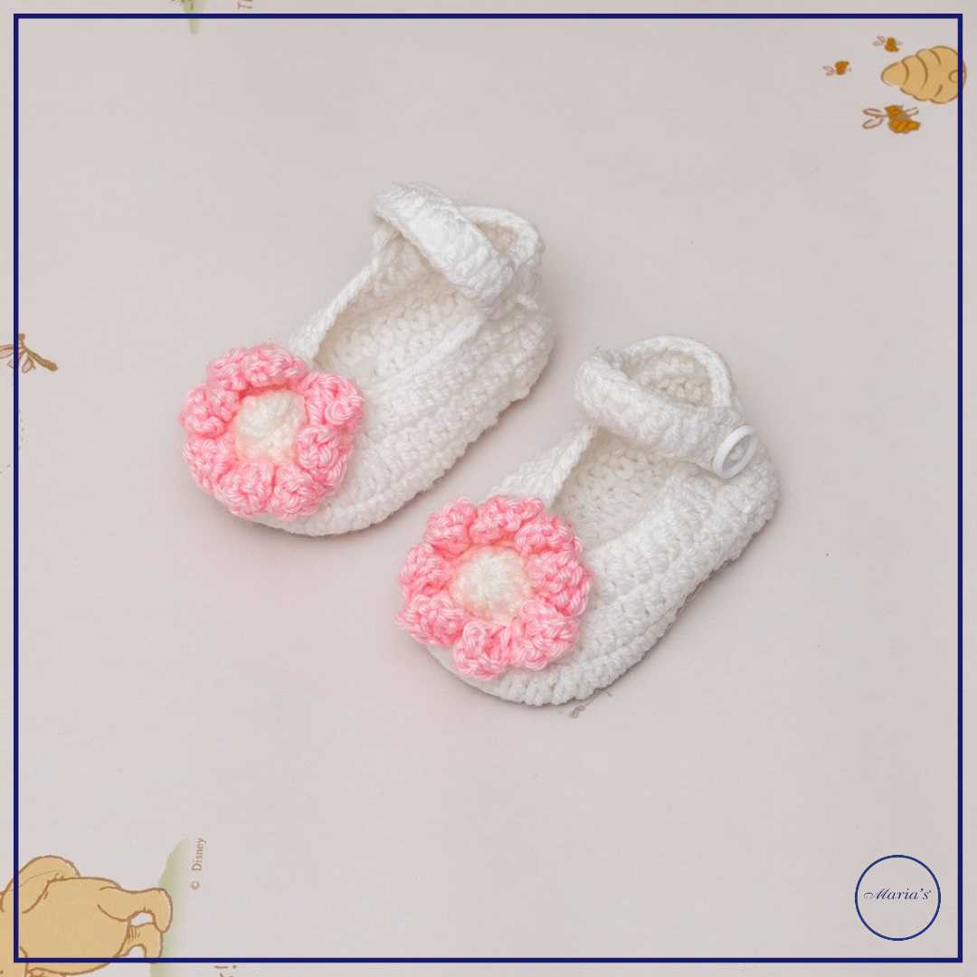 Knitted Booties With Embroidered Motive